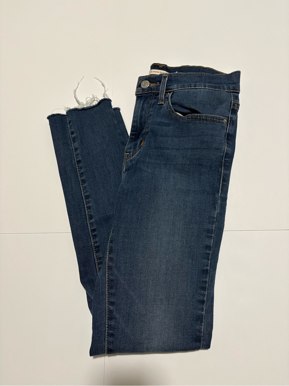 Levi’s Slimming Skinny Jeans Size 27 Blue Raw Hem Stretch Denim